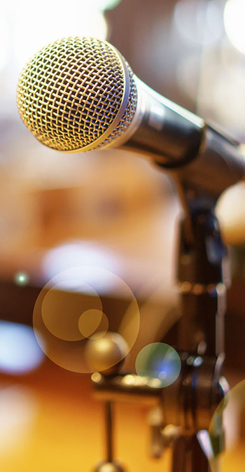 photo of a microphone on a desk being used for audio sermons